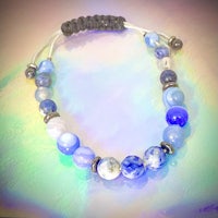 a bracelet with blue and silver beads