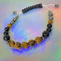 a bracelet with tiger eye beads and black beads